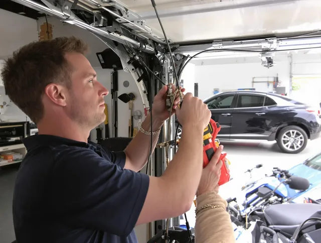 La Puente Garage Door Repair safety certified technician performing cable replacement in La Puente