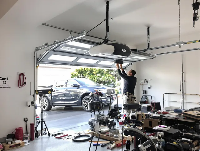 La Puente Garage Door Repair specialist installing smart garage door opener system in La Puente home